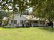 Charming single-story home with a welcoming front porch and well-maintained landscaping at 3000 Hidden Spring Ln, Oxford, NC 27565