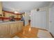 Open kitchen with stainless steel appliances, wooden cabinets and a hardwood floor at 3000 Hidden Spring Ln, Oxford, NC 27565