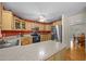 A spacious kitchen featuring wooden cabinets and modern stainless steel appliances at 3000 Hidden Spring Ln, Oxford, NC 27565