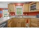 Bright kitchen features wooden cabinets, a stainless steel sink, and lots of counter space at 3000 Hidden Spring Ln, Oxford, NC 27565