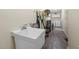 Functional laundry room with utility sink, washer, dryer, and ample storage solutions at 3000 Hidden Spring Ln, Oxford, NC 27565