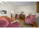 Living room showcases hardwood floors, piano, and traditional furniture at 3000 Hidden Spring Ln, Oxford, NC 27565