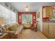 Bright room with hardwood floors, rocking chair and a sofa, decorated with decorative plates at 3000 Hidden Spring Ln, Oxford, NC 27565