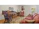 Traditional living room featuring hardwood floors, piano, and furniture at 3000 Hidden Spring Ln, Oxford, NC 27565