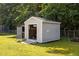 Outdoor shed perfect for storage and housing lawn equipment with roll up door at 3000 Hidden Spring Ln, Oxford, NC 27565