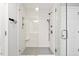 Modern bathroom with a glass shower enclosure, white subway tiles, and a shower system at 3021 Winding Waters Way, Raleigh, NC 27614