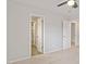 Carpeted bedroom showcasing a ceiling fan, neutral walls, and closet space at 3021 Winding Waters Way, Raleigh, NC 27614