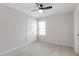 Bedroom features neutral carpet, a ceiling fan, a window, and closet at 3021 Winding Waters Way, Raleigh, NC 27614