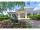 Community clubhouse featuring a statue of children riding a turtle and manicured landscaping at 3021 Winding Waters Way, Raleigh, NC 27614