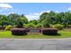 The 'Bedford' entrance is well landscaped with flowers and bushes, giving the neighborhood a warm welcome at 3021 Winding Waters Way, Raleigh, NC 27614