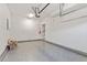 Spacious two car garage featuring an epoxy floor, automatic garage door opener, and space for storage at 3021 Winding Waters Way, Raleigh, NC 27614