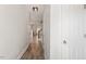 Bright hallway showcasing new laminate floors and a staircase leading to the upper level at 3021 Winding Waters Way, Raleigh, NC 27614