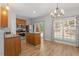Bright kitchen with stainless steel appliances, center island, and plenty of natural light from the sliding glass door at 3021 Winding Waters Way, Raleigh, NC 27614