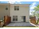 Back of home with concrete patio, sliding glass door, and wooden privacy fence at 3021 Winding Waters Way, Raleigh, NC 27614