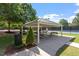 Shaded community picnic pavilion adjacent to tennis courts for relaxing after a match at 3021 Winding Waters Way, Raleigh, NC 27614