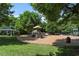 Community playground with slides, climbing structures, and covered areas provides a space for recreational activities at 3021 Winding Waters Way, Raleigh, NC 27614
