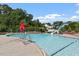 Community pool featuring zero entry access, a slide, and comfortable seating around the perimeter at 3021 Winding Waters Way, Raleigh, NC 27614