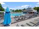 Community pool featuring ample lounge seating and a clubhouse overlooking the water at 3021 Winding Waters Way, Raleigh, NC 27614
