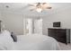 Spacious bedroom with windows, overhead fan and modern furniture at 3025 Bentwillow Dr, Fuquay Varina, NC 27526