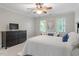 Neutral bedroom with large window provides natural light and calming atmosphere at 3025 Bentwillow Dr, Fuquay Varina, NC 27526