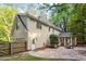 View of the rear of the home showcasing a patio and wooded backyard at 3025 Bentwillow Dr, Fuquay Varina, NC 27526