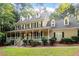 Charming two-story home with a wide front porch, perfect for relaxing outdoors and enjoying the neighborhood at 3025 Bentwillow Dr, Fuquay Varina, NC 27526