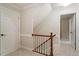 Upstairs hallway with carpet and views of the entryway to bedrooms and stairway at 3025 Bentwillow Dr, Fuquay Varina, NC 27526