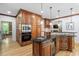 Kitchen features a large island, custom cabinetry, and stainless steel appliances at 3025 Bentwillow Dr, Fuquay Varina, NC 27526