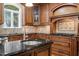 Gourmet kitchen features granite countertops, custom cabinets, and stainless steel appliances at 3025 Bentwillow Dr, Fuquay Varina, NC 27526