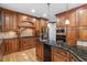 Gourmet kitchen features granite countertops, custom cabinets, and stainless steel appliances at 3025 Bentwillow Dr, Fuquay Varina, NC 27526