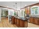 Open concept kitchen with stainless steel appliances, granite countertops and breakfast bar seating at 3025 Bentwillow Dr, Fuquay Varina, NC 27526