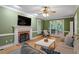 Cozy living room with fireplace, hardwood floors, and neutral paint, creating a warm and inviting atmosphere at 3025 Bentwillow Dr, Fuquay Varina, NC 27526