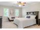 Inviting main bedroom features windows, natural light and a seating area to relax at 3025 Bentwillow Dr, Fuquay Varina, NC 27526