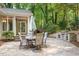 Backyard patio features a built-in grill and dining area at 3025 Bentwillow Dr, Fuquay Varina, NC 27526