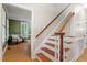 Stairway with wooden handrail and hardwood steps lead to a landing and carpeted floor at 3025 Bentwillow Dr, Fuquay Varina, NC 27526