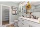 Updated bathroom boasts double sink vanity, modern fixtures, decor and great storage throughout at 303 Godwin St, Selma, NC 27576