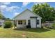 Charming home featuring a white exterior, well-maintained lawn, and inviting backyard perfect for outdoor activities at 303 Godwin St, Selma, NC 27576