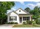 Charming home featuring a well maintained yard, neutral colors and dark shutters for added curb appeal at 303 Godwin St, Selma, NC 27576