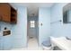 Bathroom with blue fixtures and some water damage, including a sink, toilet, and bathtub/shower combo at 3204 Friar Tuck Rd Rd, Raleigh, NC 27610