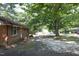 Charming brick single story house surrounded by mature trees at 3204 Friar Tuck Rd Rd, Raleigh, NC 27610