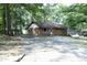 Charming brick single story house surrounded by mature trees at 3204 Friar Tuck Rd Rd, Raleigh, NC 27610