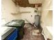 Functional Storage Room with water heater, shelving, and room for bins provides organization solutions at 3204 Friar Tuck Rd Rd, Raleigh, NC 27610