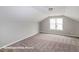 Cozy bedroom with neutral carpet, a window, and a clean, minimalist design at 348 Danube Dr, Zebulon, NC 27597