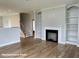 Spacious living room with a fireplace, built-in bookshelves, and hardwood floors at 348 Danube Dr, Zebulon, NC 27597