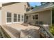 Spacious outdoor deck with multiple seating options and a view of the expansive, grassy backyard at 3506 Arthur Minnis Rd, Hillsborough, NC 27278