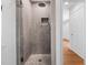 Contemporary bathroom boasts a tiled shower, rain shower head, and built-in niche for a spa-like experience at 3506 Arthur Minnis Rd, Hillsborough, NC 27278