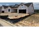 New home construction with attached two-bay garage, ready for your personal touches at 36 Firefly Ln, Fuquay Varina, NC 27526