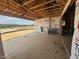 Covered patio under construction, featuring an outdoor fireplace and a view of the landscape at 36 Firefly Ln, Fuquay Varina, NC 27526