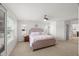 Bedroom with a comfortable bed, natural lighting, and a ceiling fan at 3601 Lily Orchard Way, Apex, NC 27539