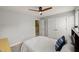Neutral bedroom features a modern ceiling fan, and a double-door closet, offering style and ample storage at 3601 Lily Orchard Way, Apex, NC 27539